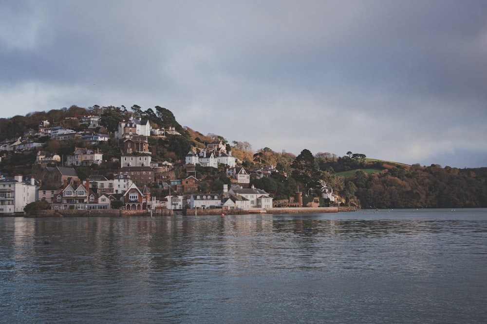 a town on a hill by the water