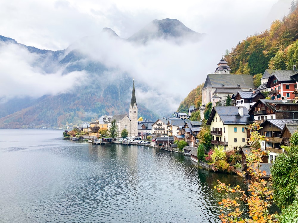a town next to a body of water with Hallstatt in the background