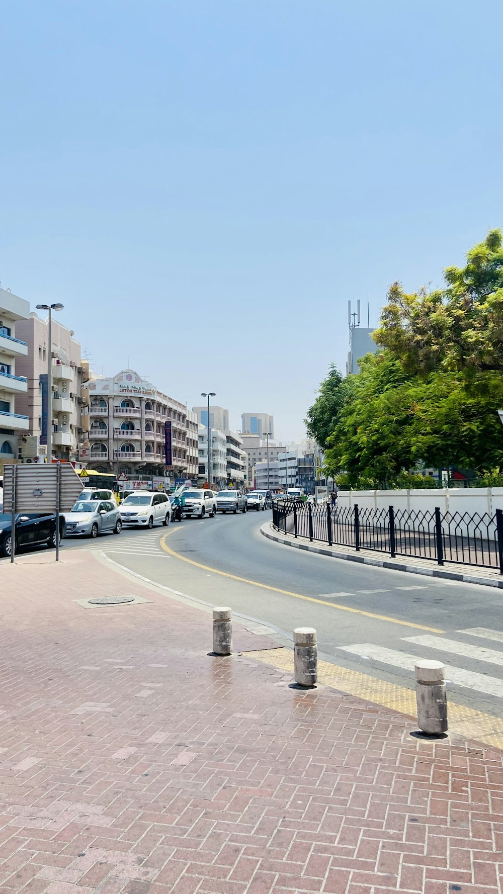 a street with cars on it and buildings in the back