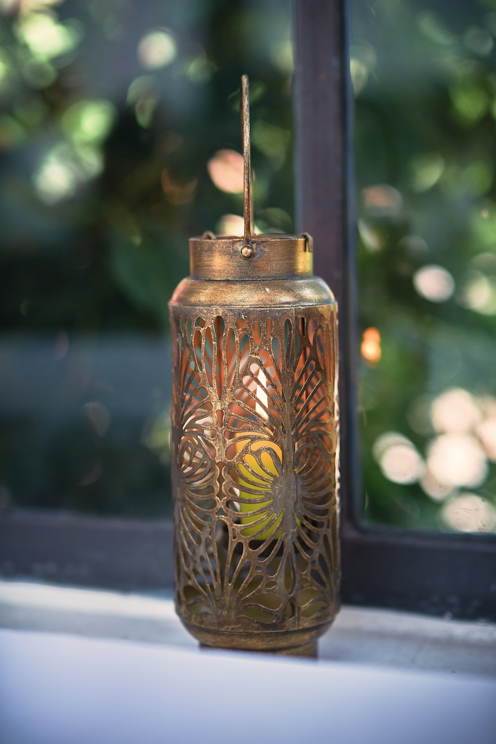 a glass jar with a bird on it