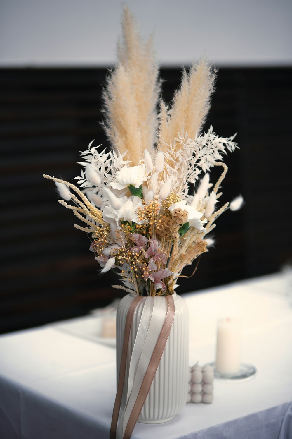 a vase with white flowers