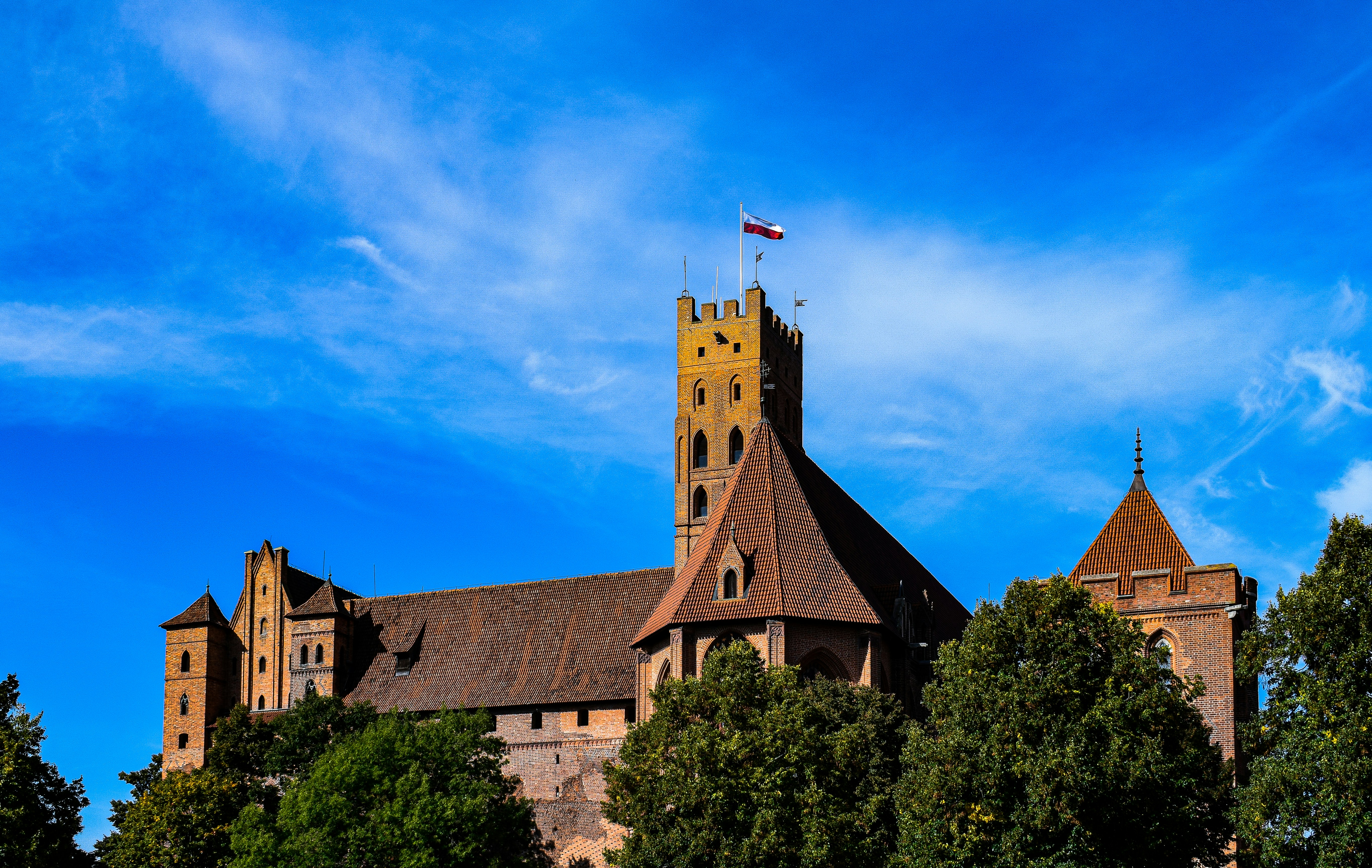 a large building with a flag on top