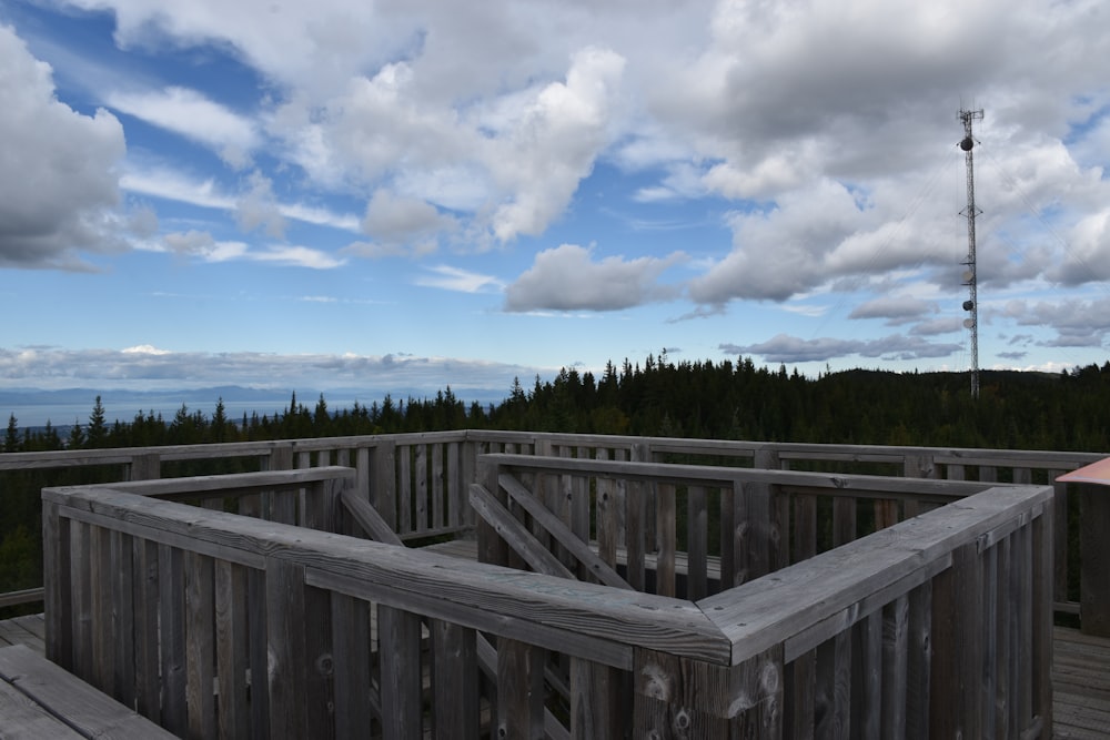 a wooden deck overlooking a forest