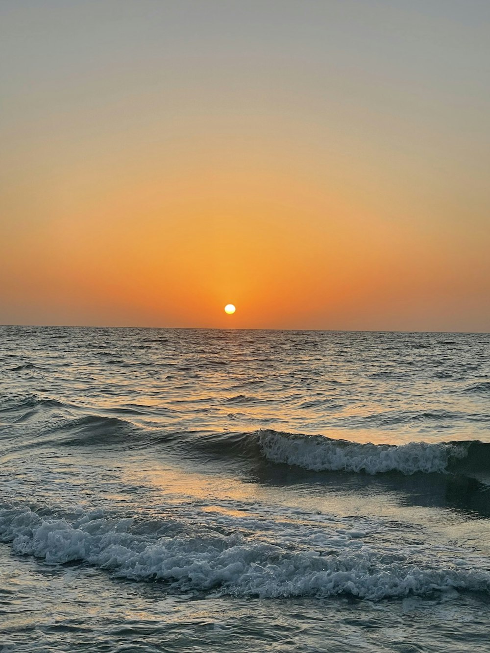 a sunset over the ocean