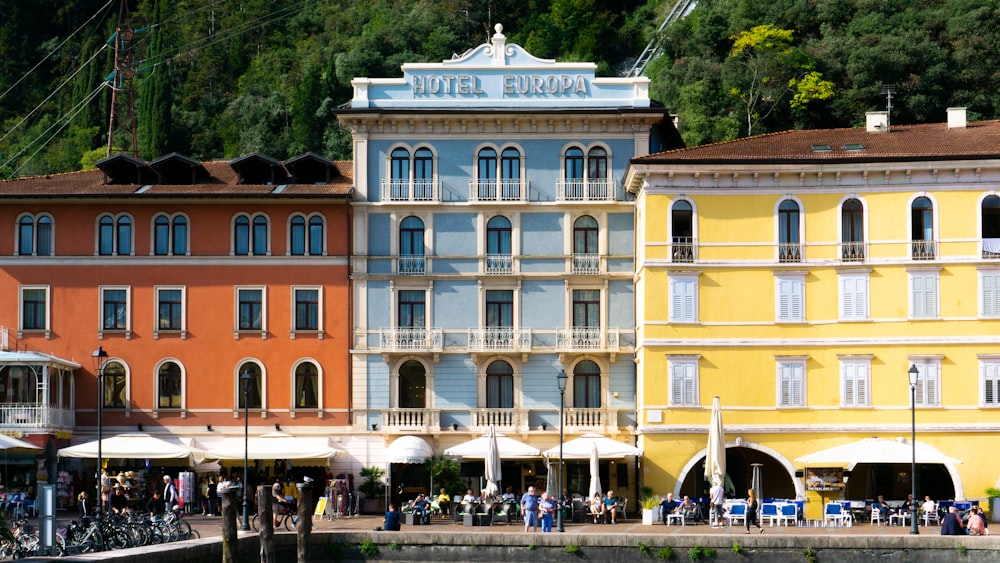 a group of buildings with people walking around