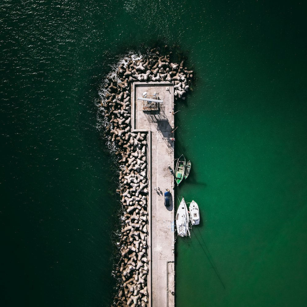 a stone structure in the middle of a body of water