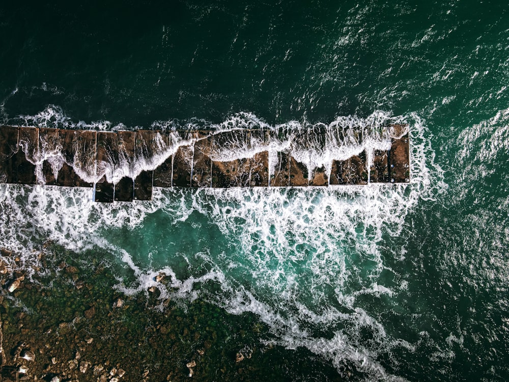 a wave crashing on a rock