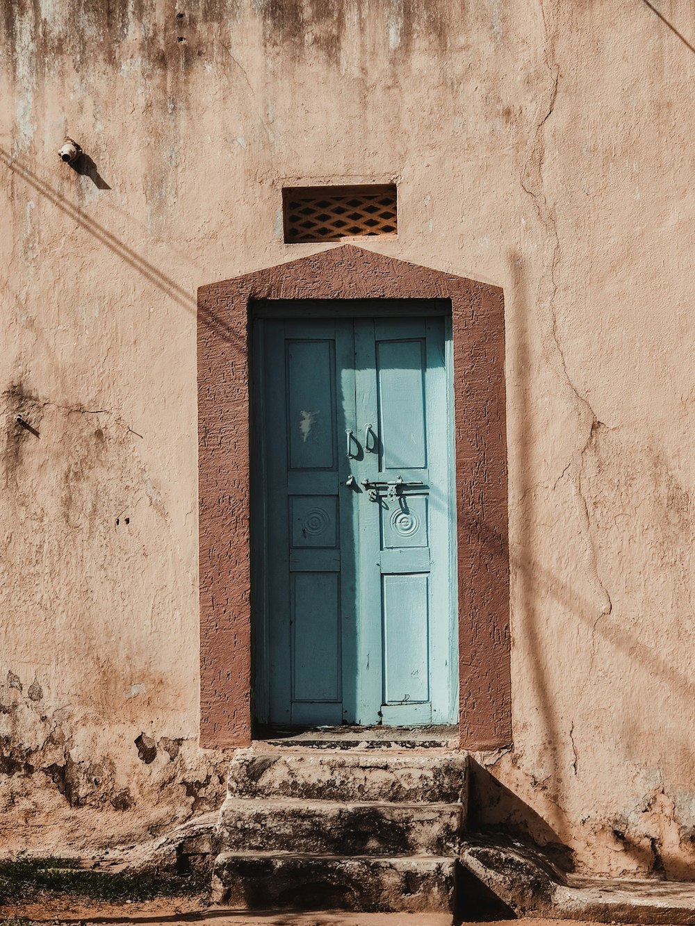 a blue door on a stone building