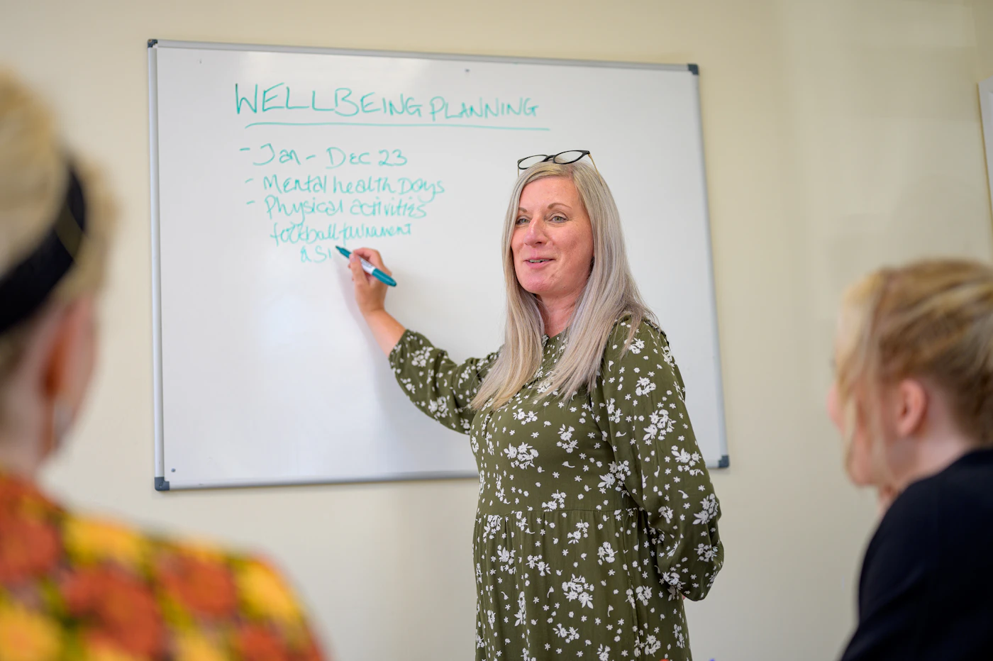 TEFL teacher leading an engaged group activity with English language students
