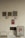 A beige tiled wall contains various fire safety and parking signs. Two sprinkler fire alarm circular signs are mounted on the wall above red signs indicating a fire department connection. There is a prominent 'NO PARKING' sign to the right side, and two wall vents and a central air vent are also visible.