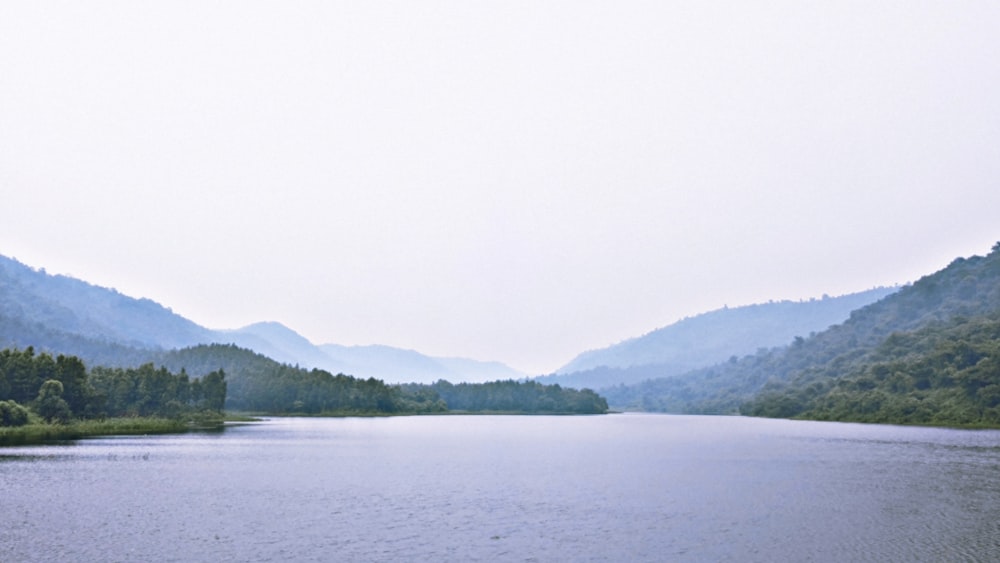 a lake with mountains in the background