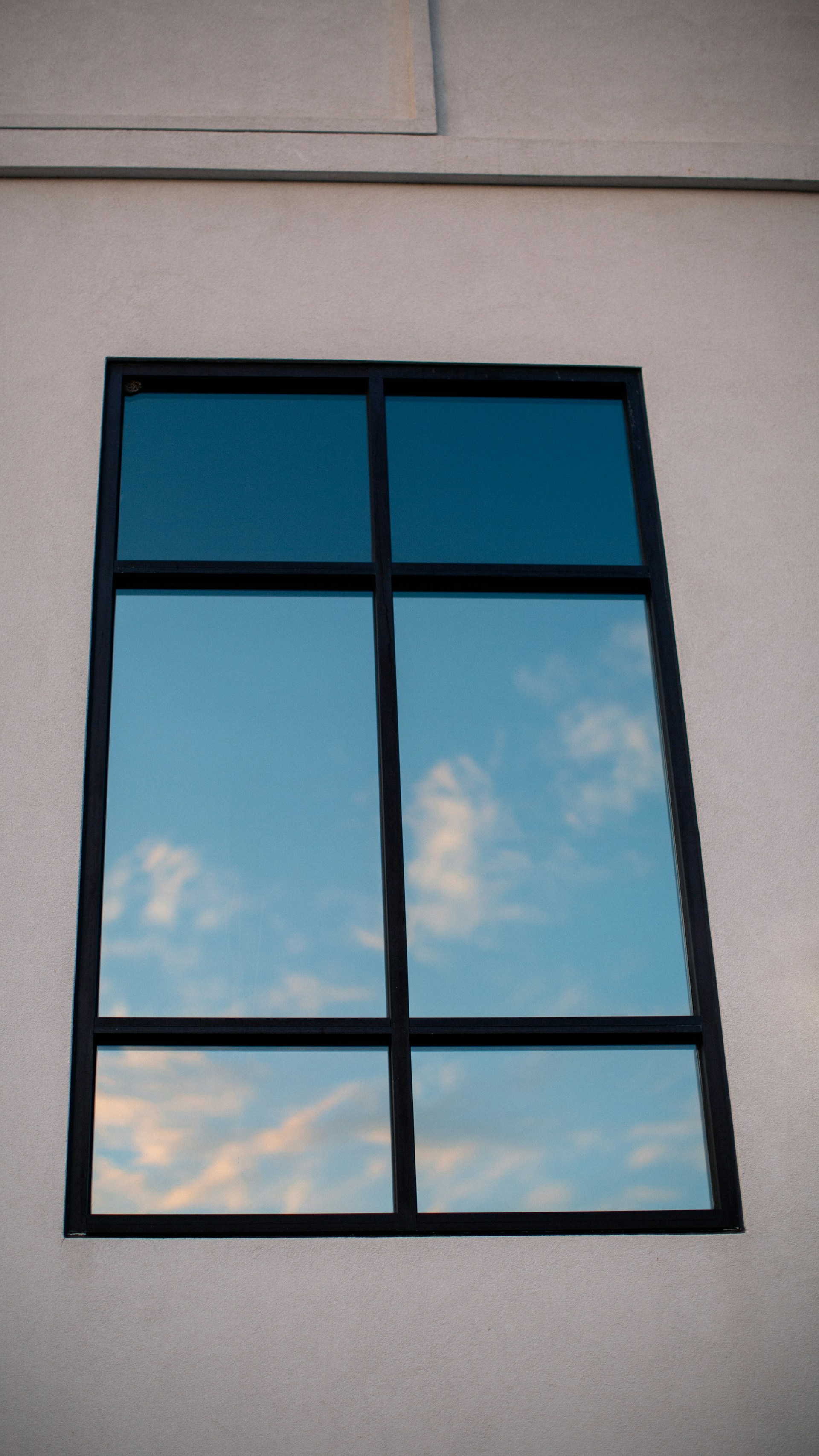 a window with a blue sky