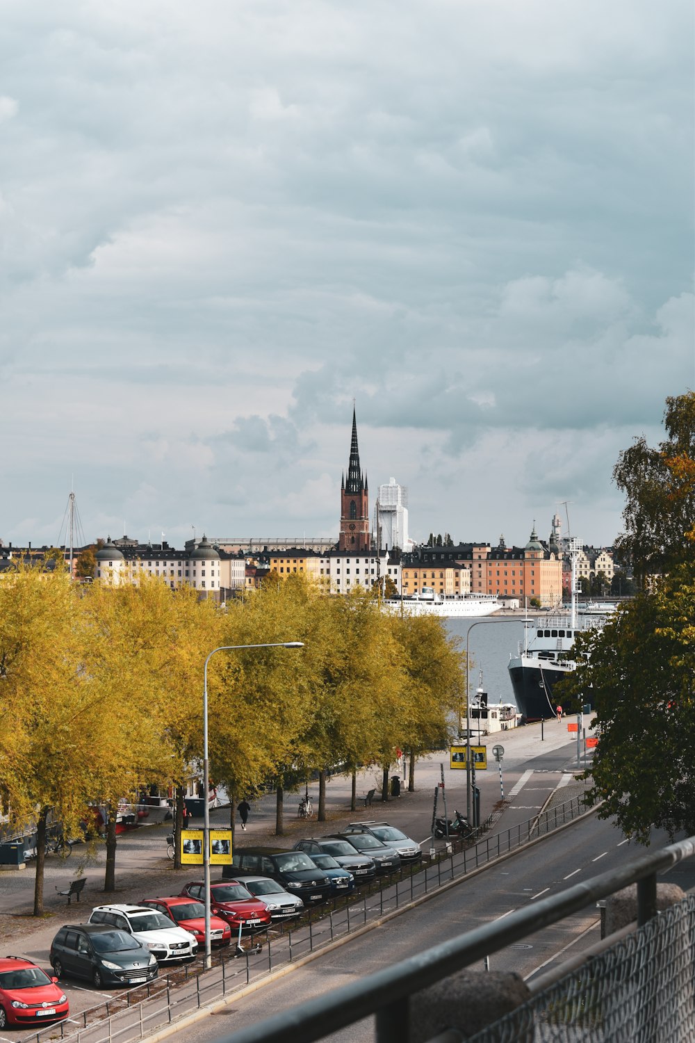 a city with a river and cars