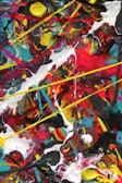 A vibrant abstract painting bursting with reds and blues, evoking energy and passion.