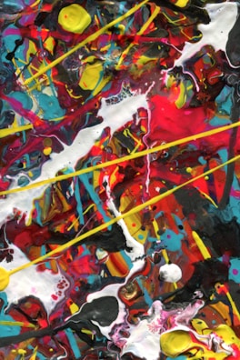 A vibrant abstract painting bursting with reds and blues, evoking energy and passion.