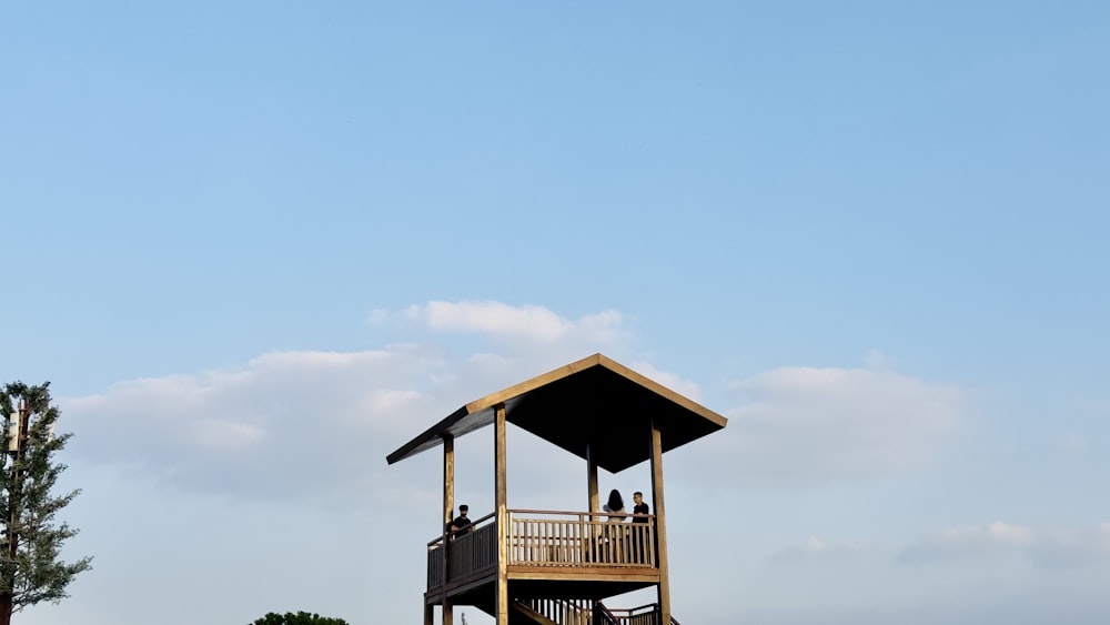 a group of people on a wooden structure