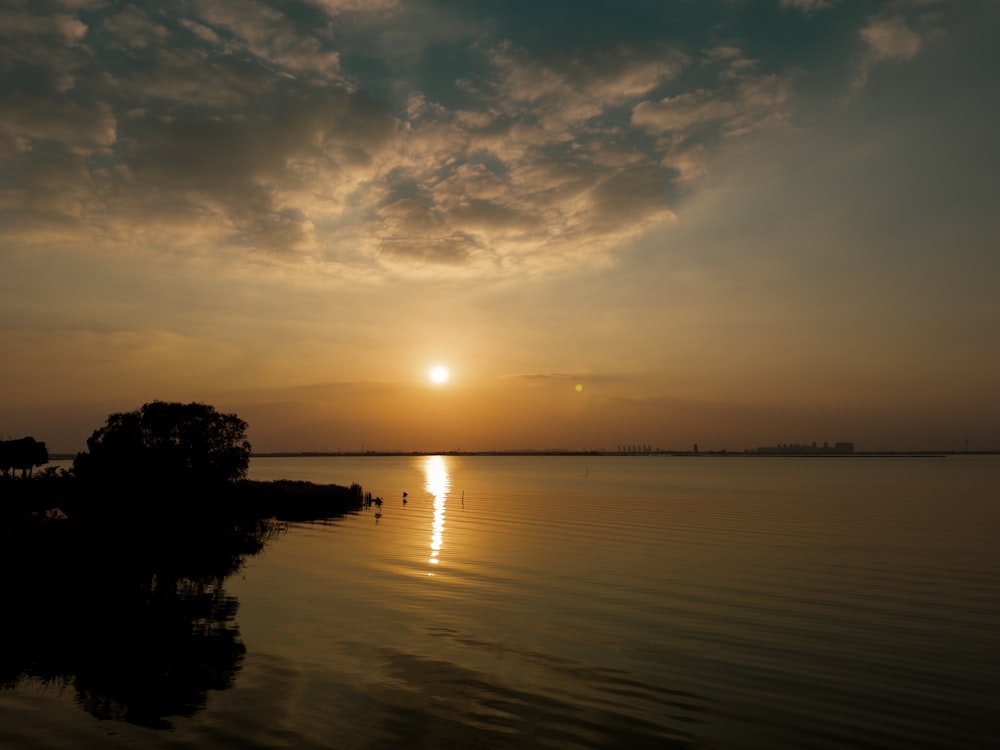 a sunset over a lake