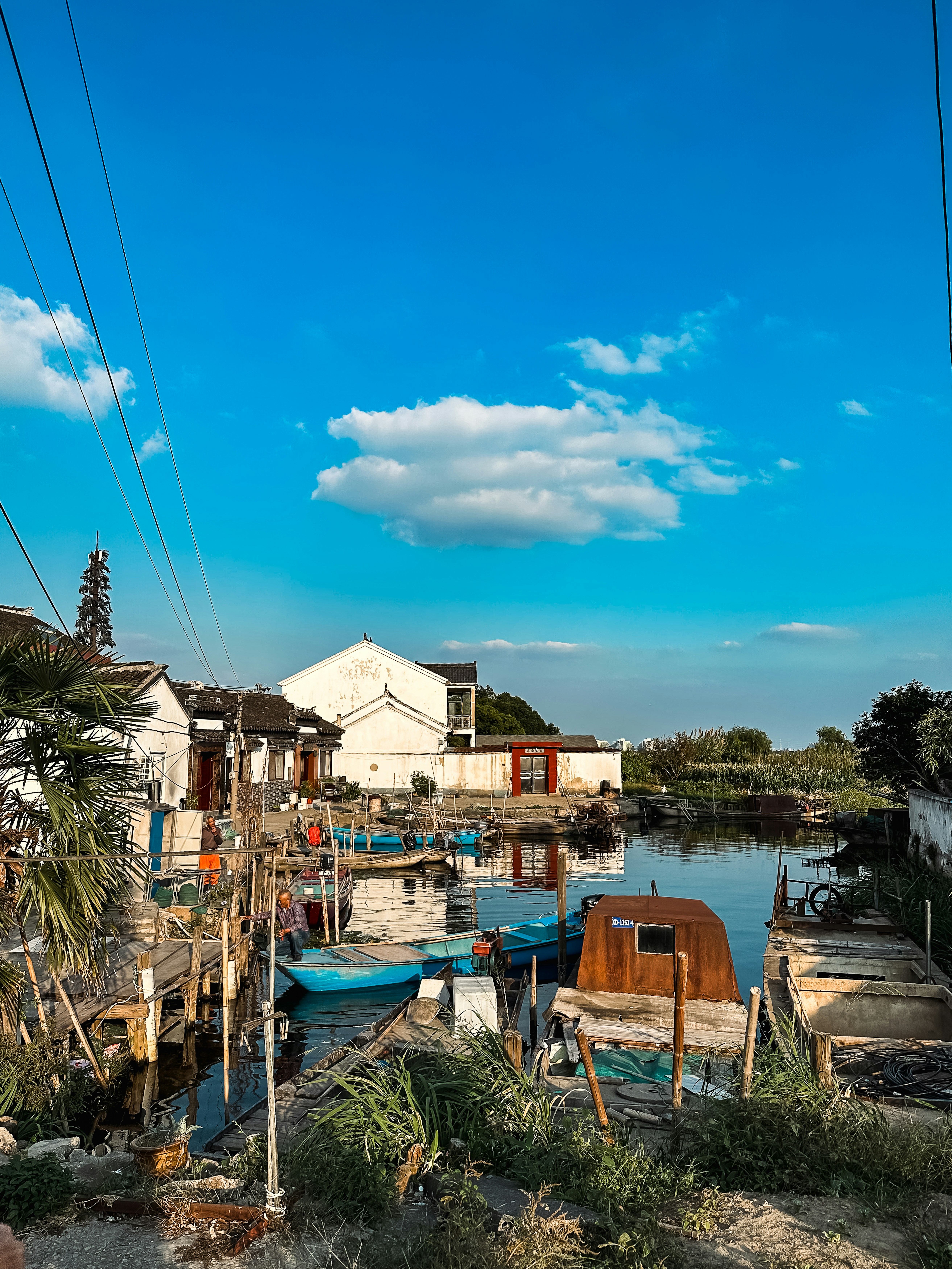 a body of water with boats and buildings along it