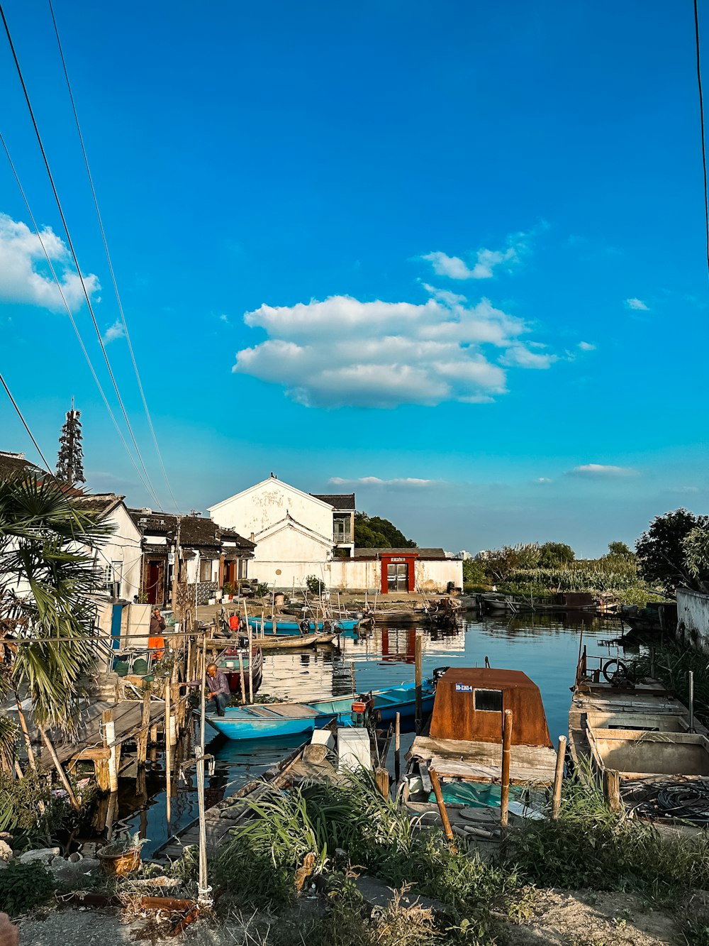 a body of water with boats and buildings along it