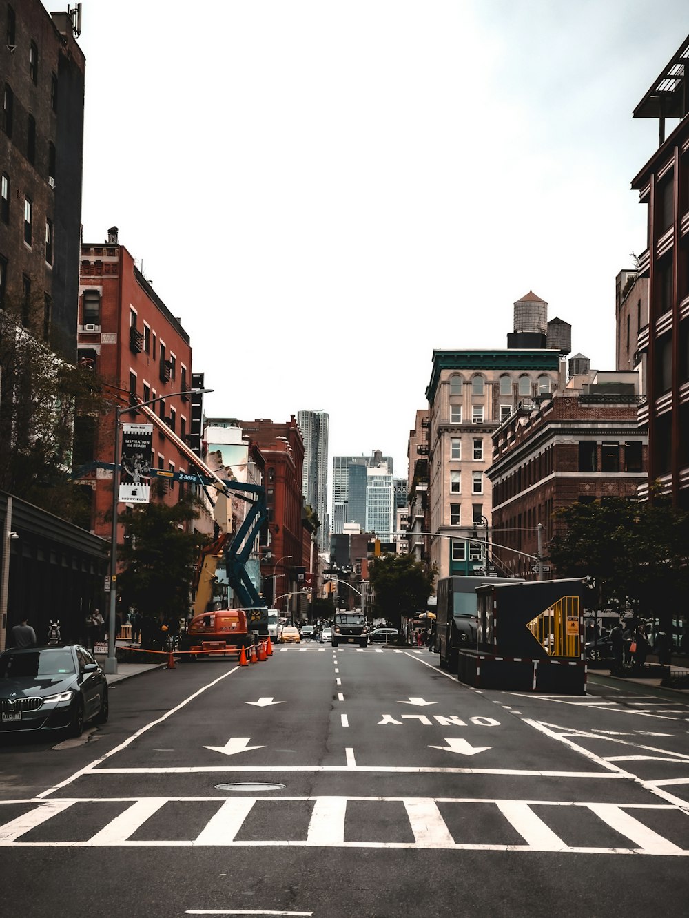 a city street with buildings and cars