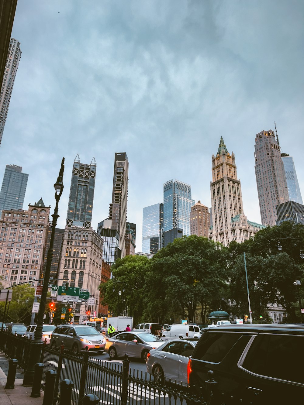 a city street with cars and trees