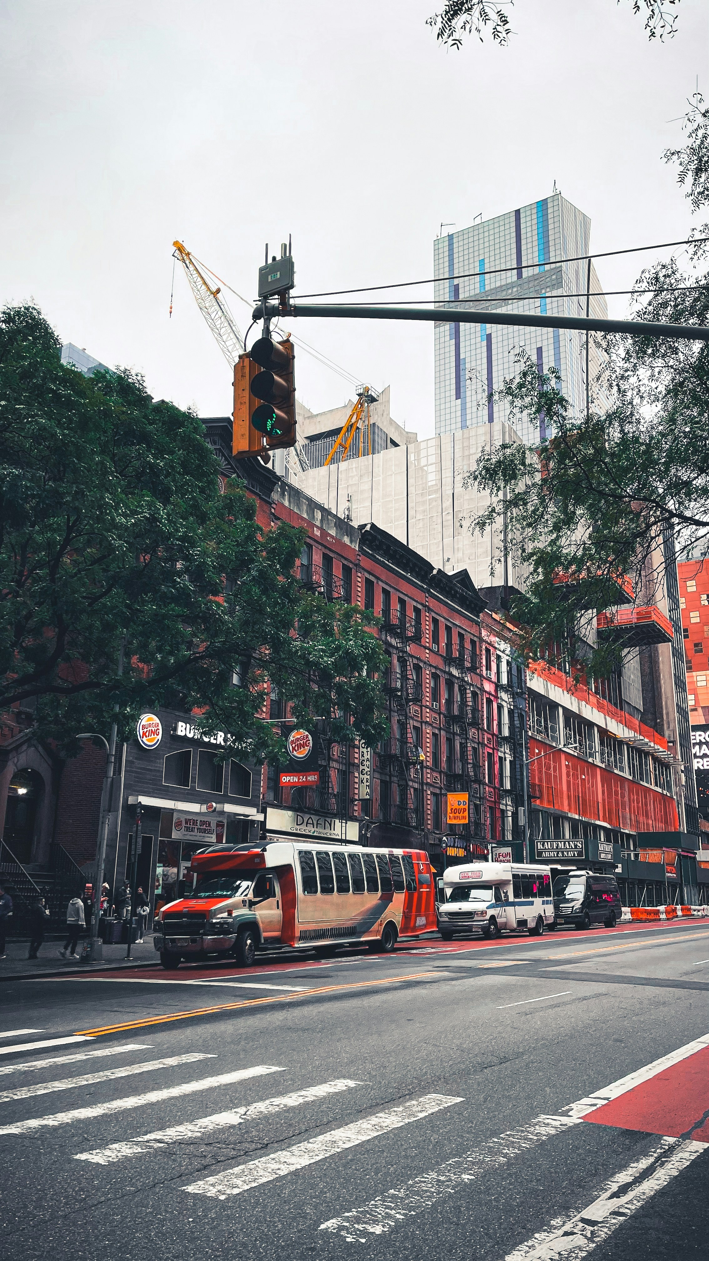 A street with a traffic light and buildings in the background photo ...