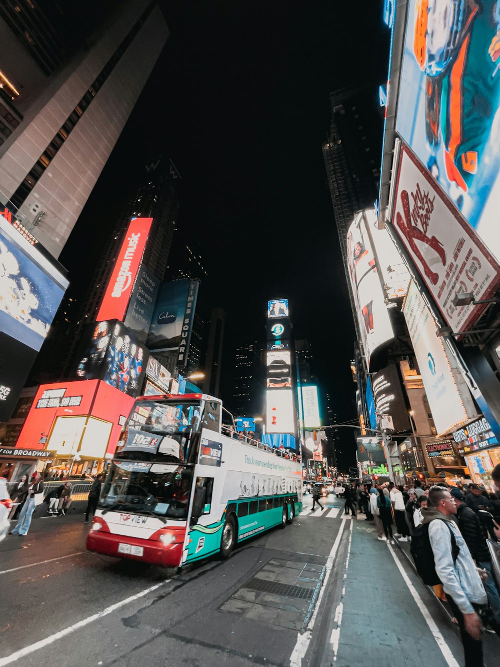 a bus travels down a street