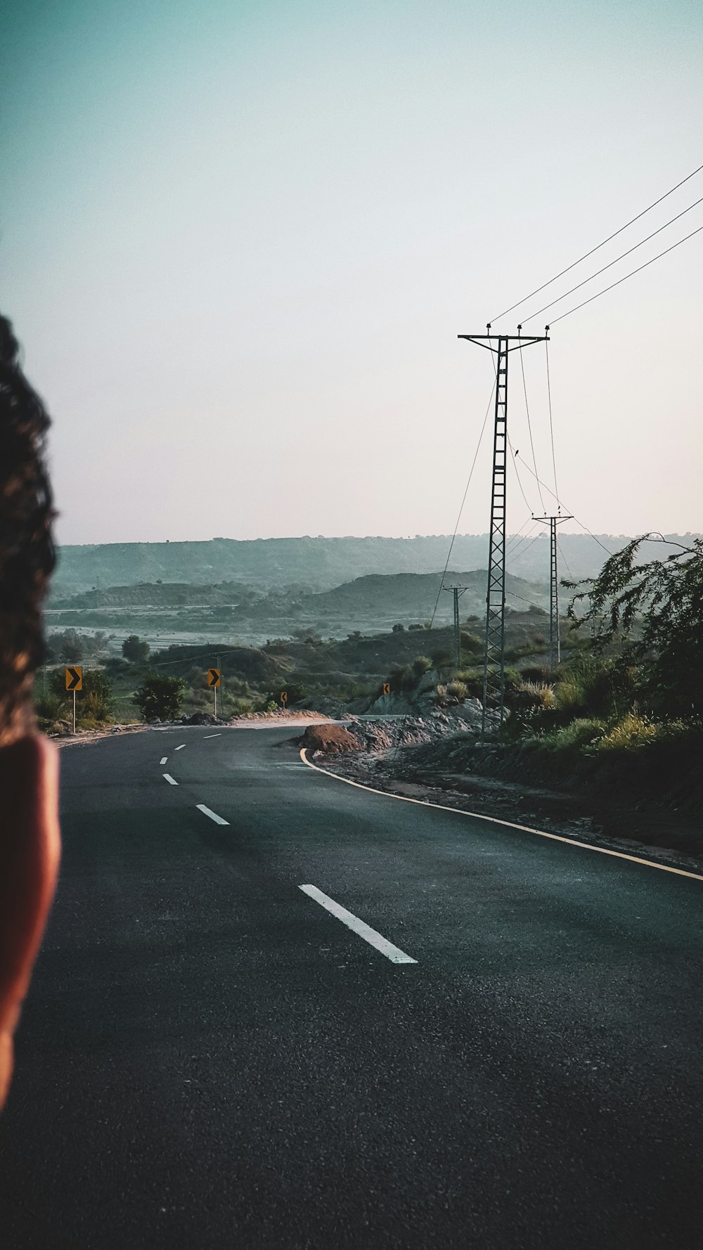 a road with a tower on the side