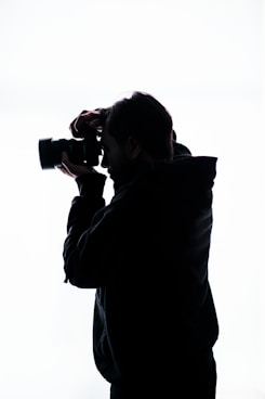 a man holding a camera
