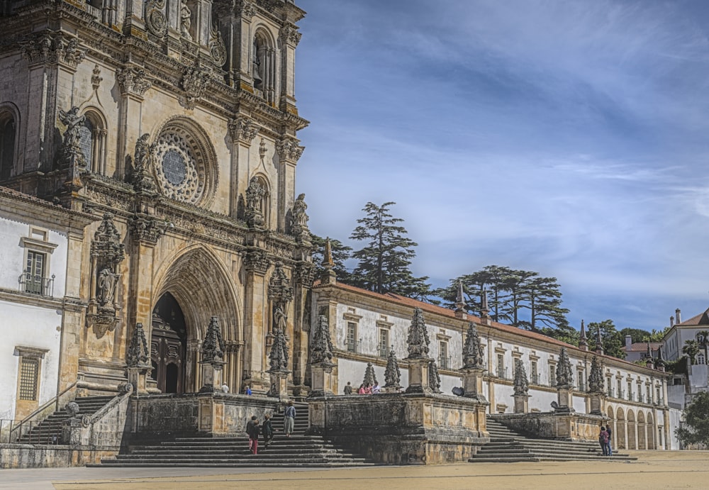 a building with stairs and statues