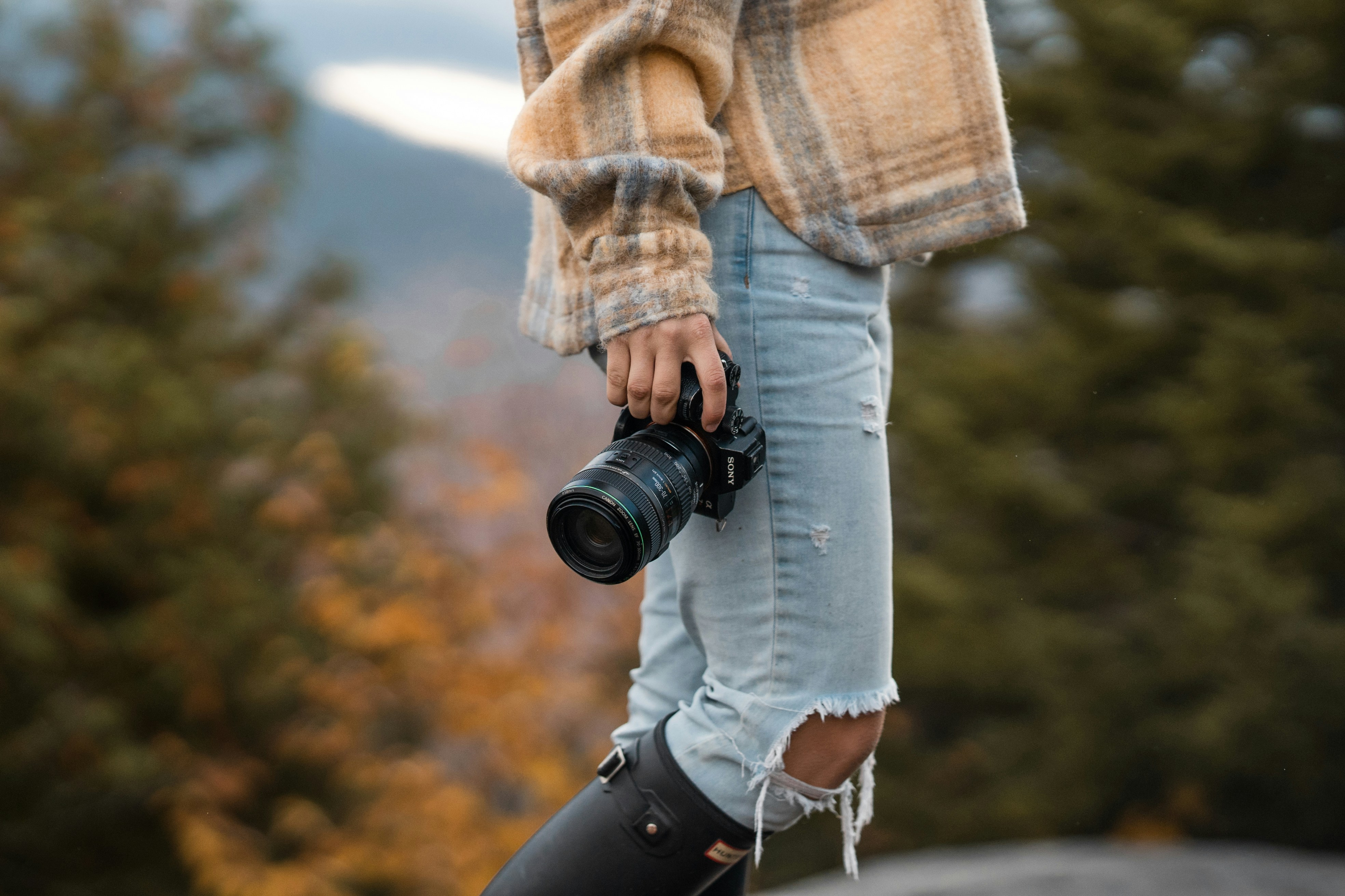 a person holding a camera, 