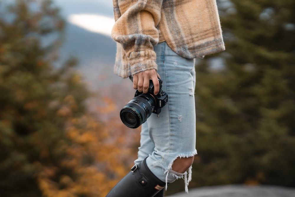 a person holding a camera