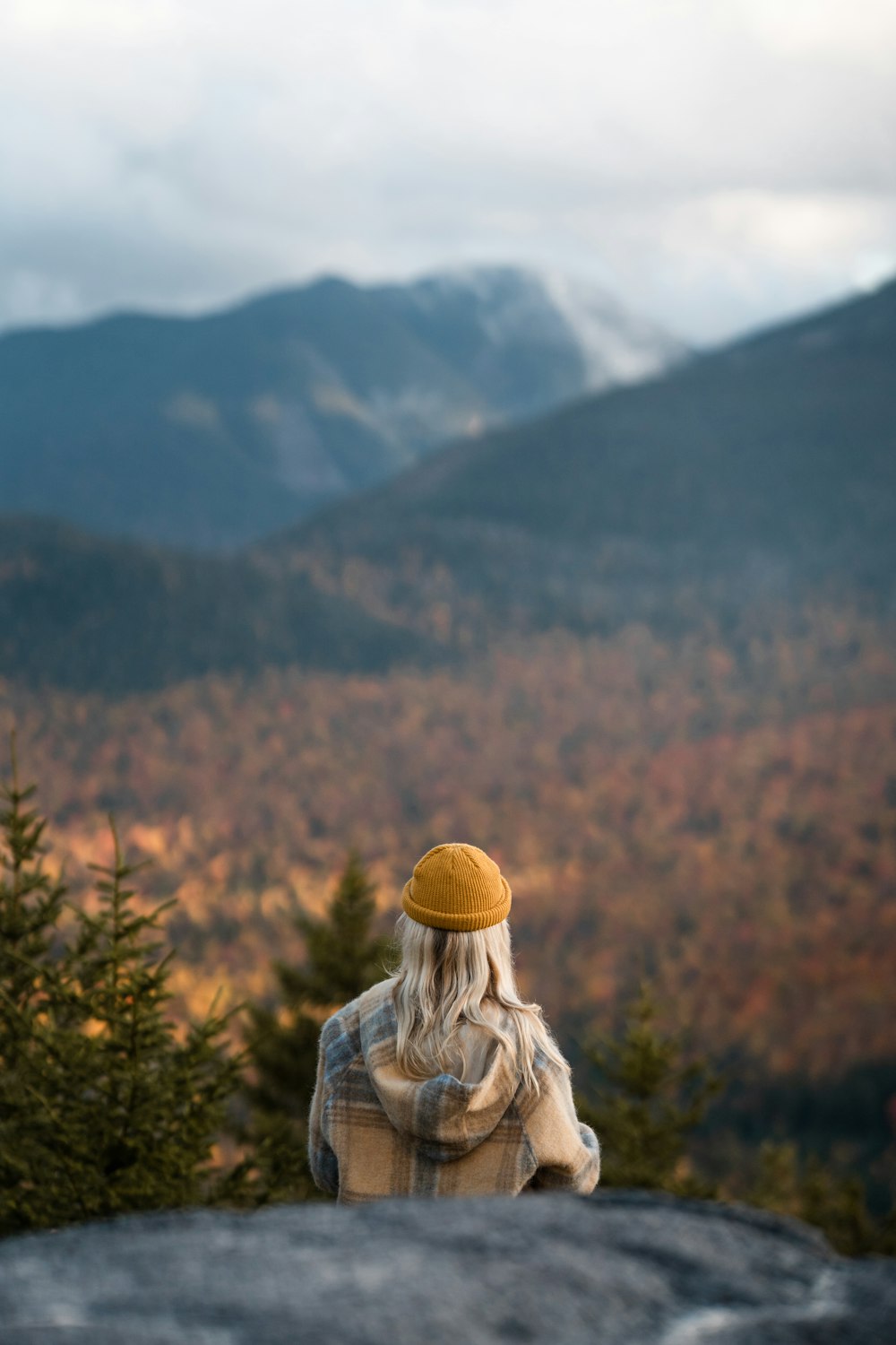 a person sitting on a rock