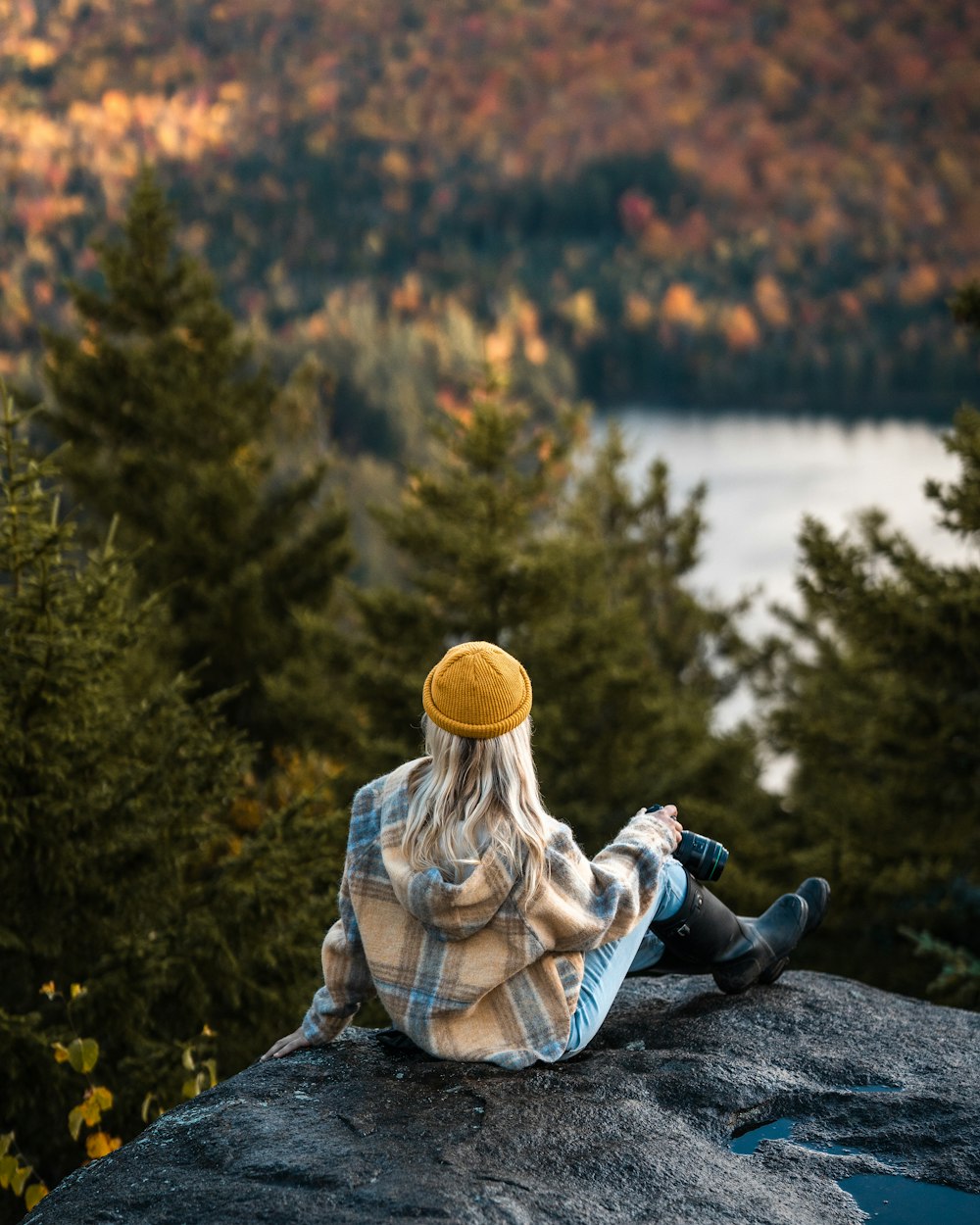 a person sitting on a rock