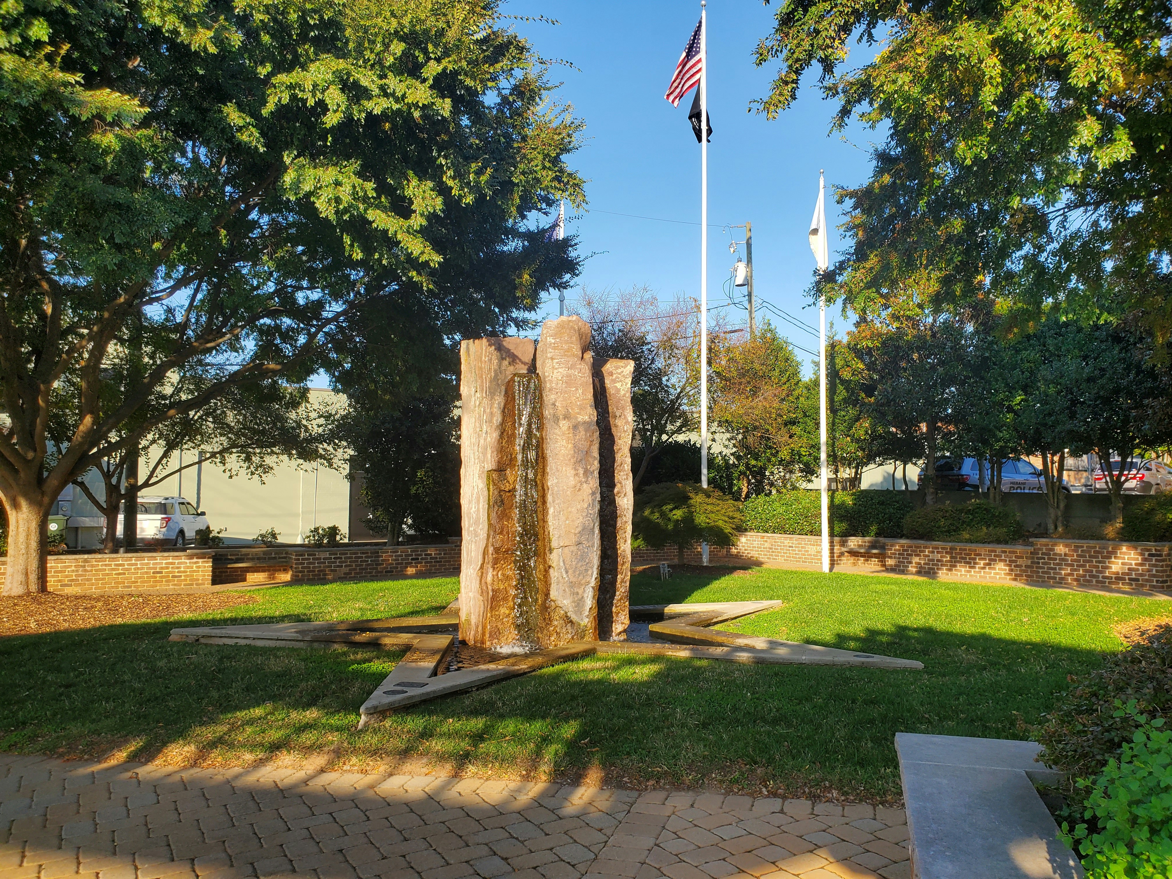 a stone statue in a park