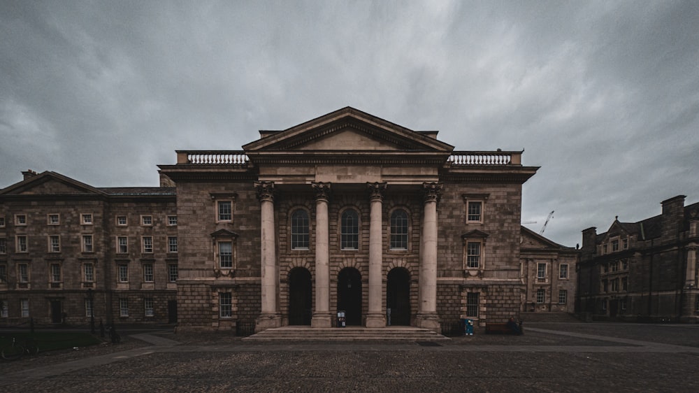 a large brick building with pillars