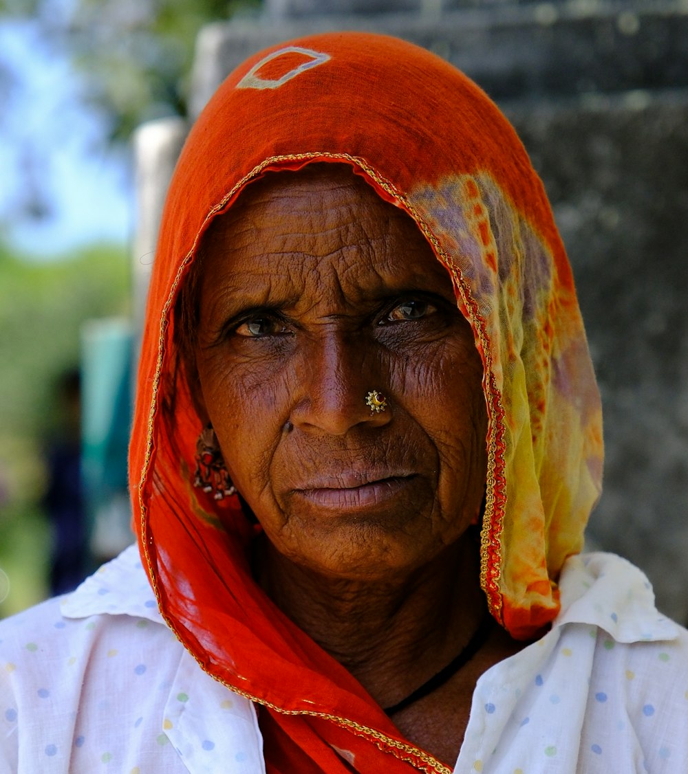 a man with a red head covering