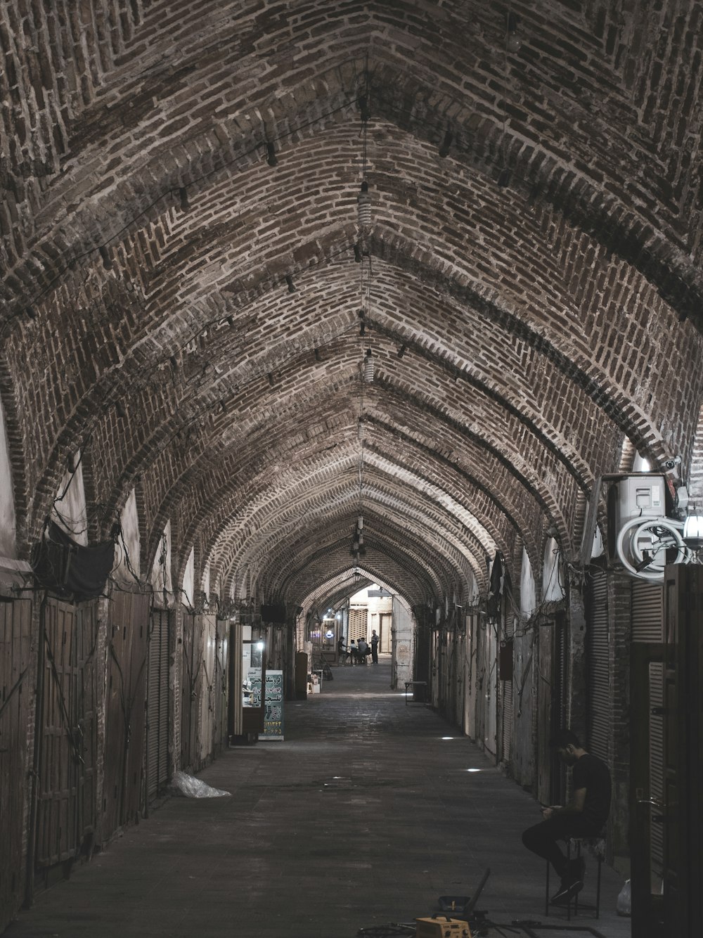 a long hallway with a chair