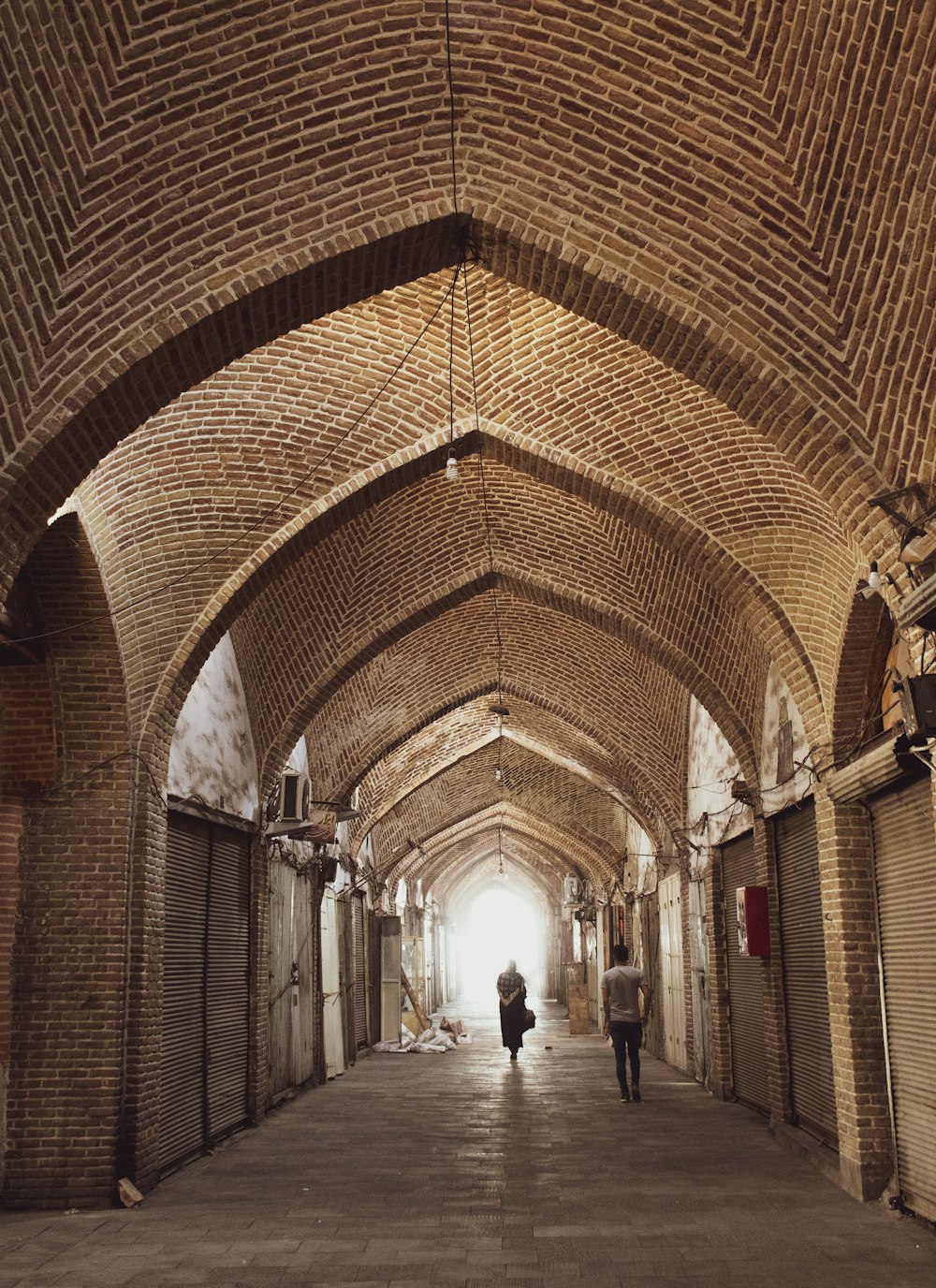 a couple walking in a large building