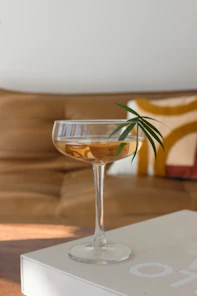 An open e-book on a tablet showing colorful cocktail recipes with garnishes.