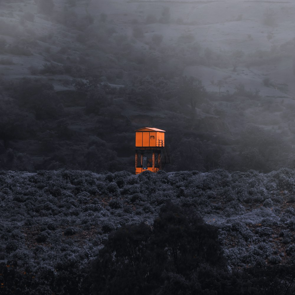 a yellow house on a hill