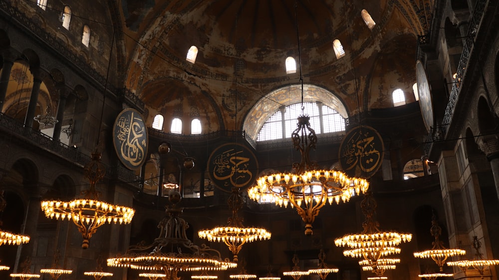 a large ornate building with chandeliers and lights