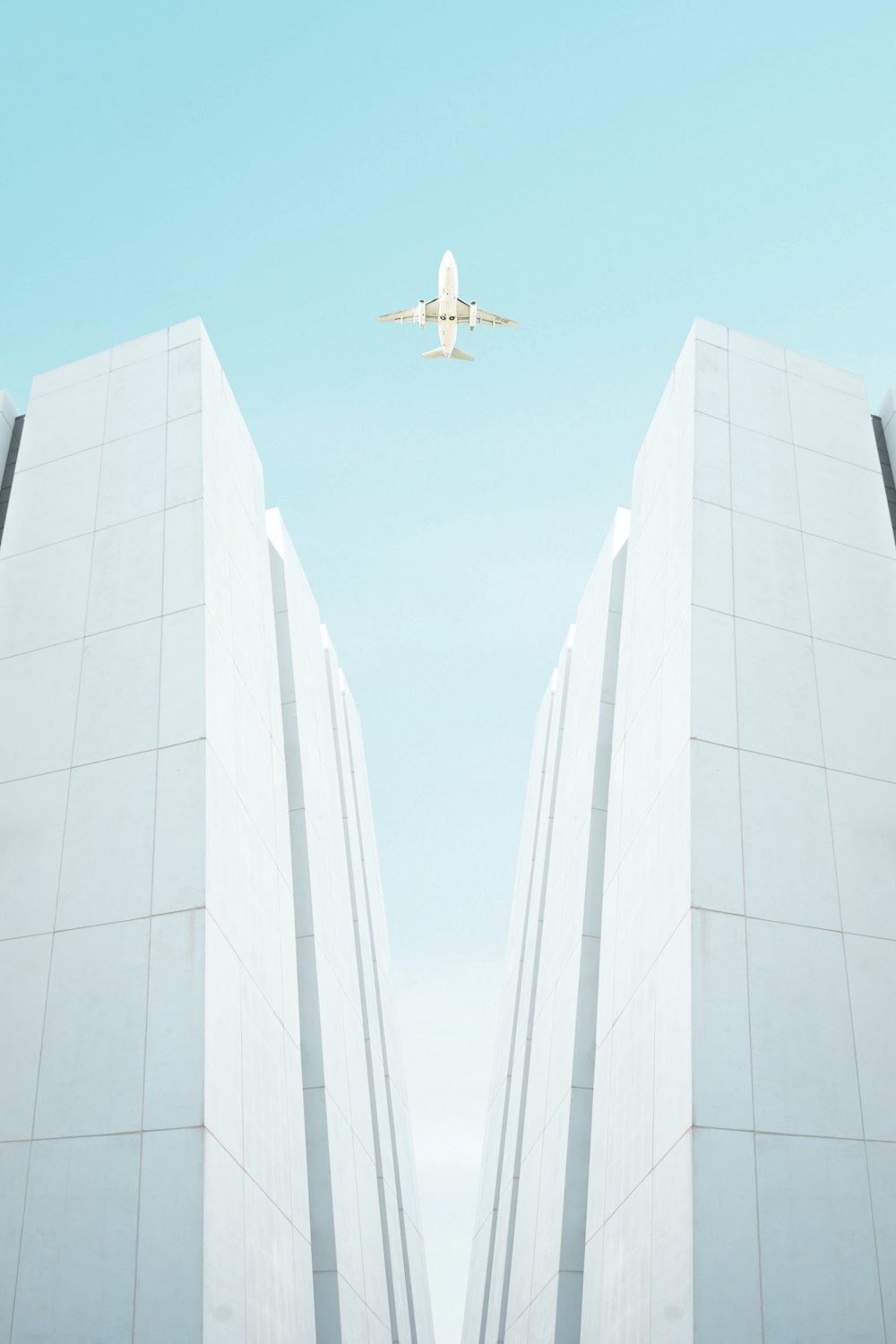 a plane flying over a building