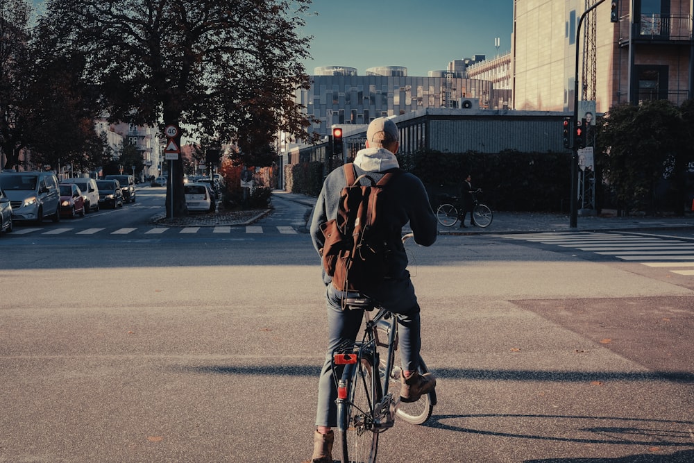 a man and woman riding a bicycle