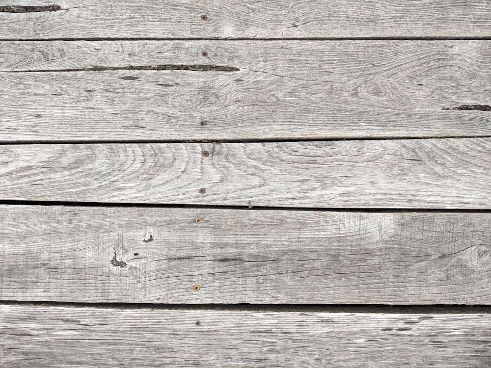 a wood surface with small holes