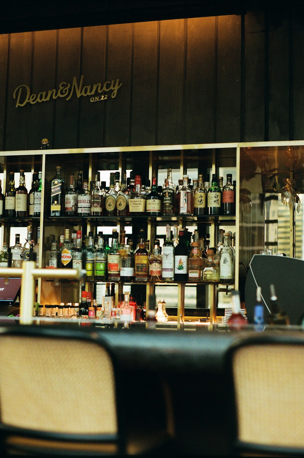 a bar with many bottles of alcohol