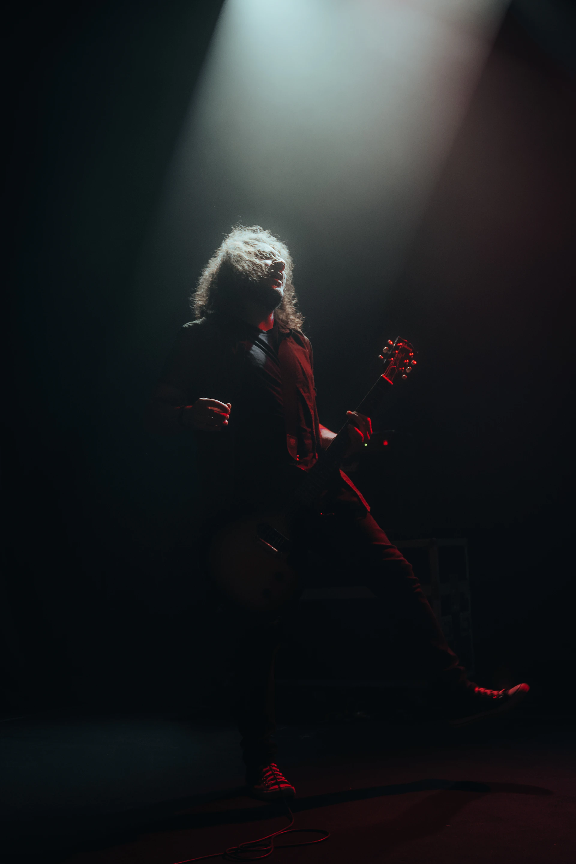 a person playing a guitar