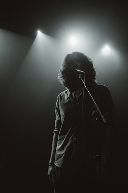 a man singing into a microphone