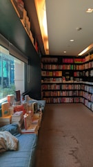 Cozy bookstore interior with shelves filled with diverse books and warm lighting.