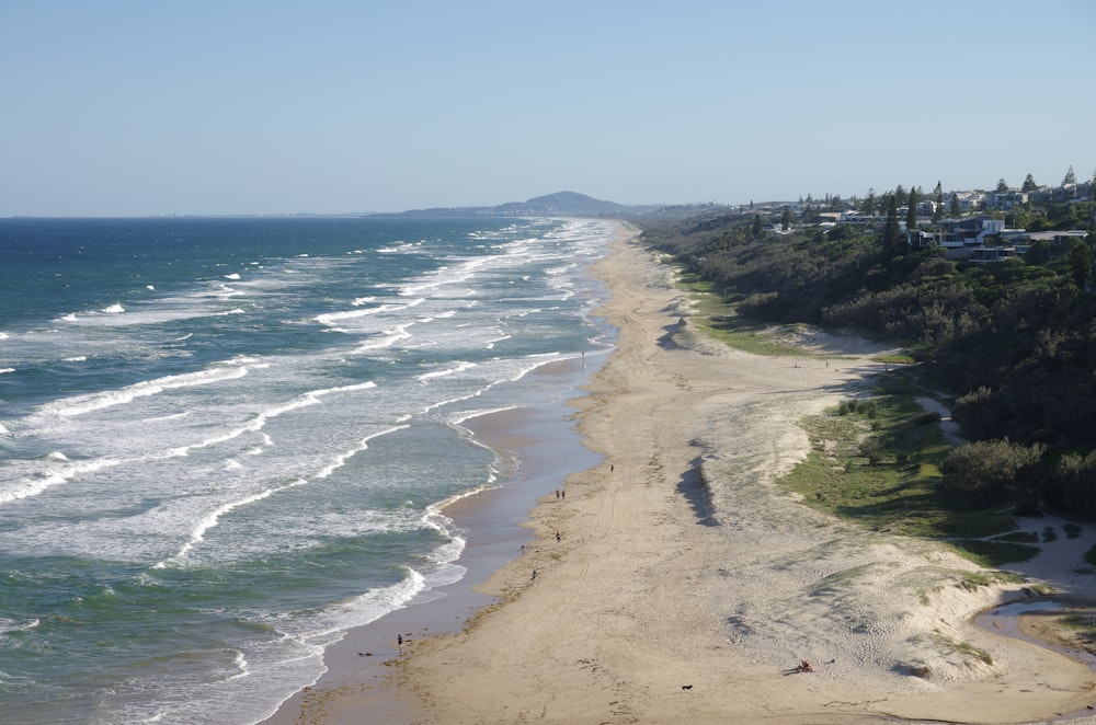 a beach with waves crashing on it